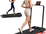a woman running on a treadmill with a tablet on top of it