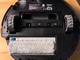 an image of a robotic vacuum cleaner sitting on top of a wooden floor