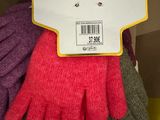 many gloves that are on display in a store