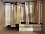 a lot of books in the box on the shelf