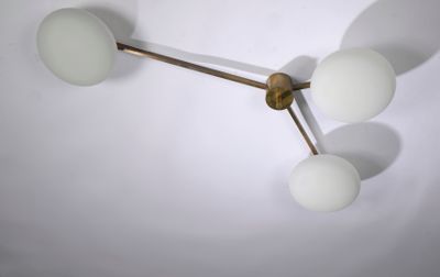 three lights that are hanging from the ceiling
