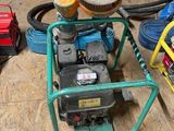 a machine that is sitting on the floor in the garage