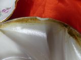 a close up of a plate and a bowl on a table