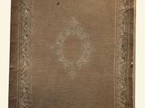 an old book with a decorative design on it