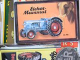 a box full of books and a toy tractor in it