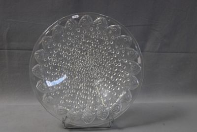 a glass plate with a design on it on a stand