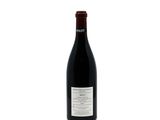 a bottle of wine that is sitting on a table