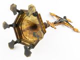 a gold clock with a cross on it and a cross on it