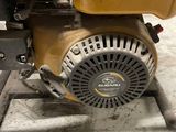 a small engine that is sitting on a stand