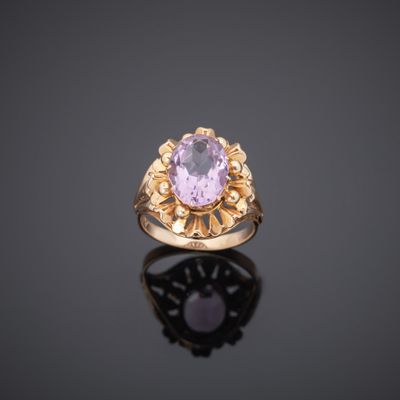 an amethorate and gold ring, set with an oval amethorate