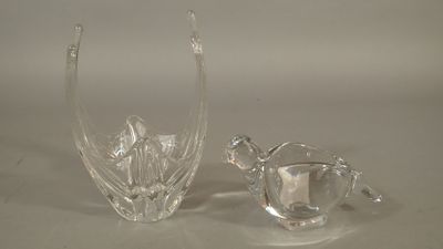 two glass vases that are sitting on a table