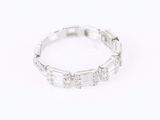 a close up of a diamond ring on a white background