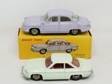 two toy cars sitting on top of a box next to each other