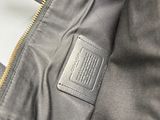 the inside of a grey bag with a label on it