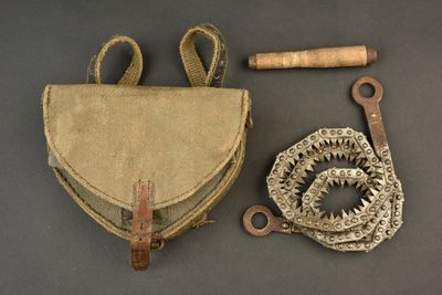 a small bag and a pair of scissors on a table