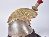 a silver helmet with a red mohawk on it
