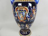 a blue vase with a gold and blue decoration on it