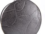 black leather round purse on a white background