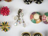 many different types of jewelry on a white surface