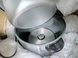 a silver blender sitting in a box on a table