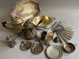 a lot of silver items that are on the table