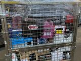 a metal cart with many items in it in a warehouse
