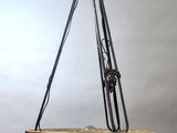 a close up of a bowl hanging from a metal pole