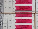 a lot of red and white labels on a table