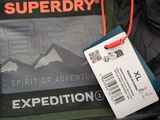 the jacket is black and green with a tag on it