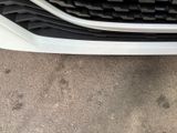 a close up of a car ' s front bumper and grille