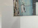 a picture of a painting hanging on the wall of a room