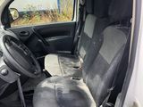 the interior of a car with the door open showing the driver ' s seat and dashboard