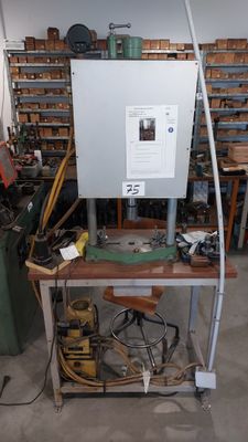 a picture of a workbench in a workshop with tools on it