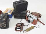 many different types of old cameras on the table