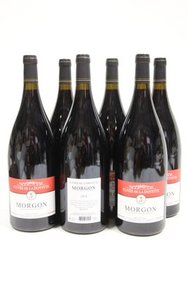 six bottles of red wine are lined up on a white surface