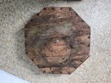 a wooden object on the floor of a bathroom