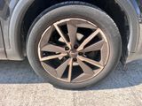 a close up of a tire on a car ' s rim