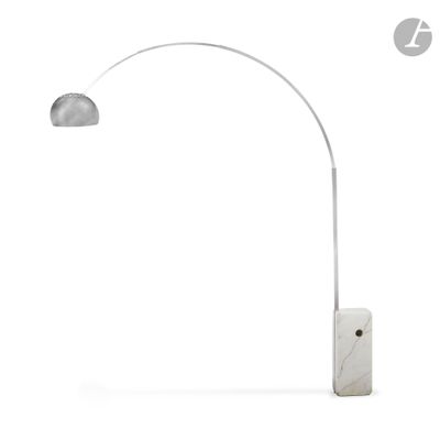 the floor lamp has a marble base and a white marble base