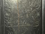 a picture of a metal door with a design on it