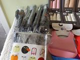 a lot of pens and scissors on a table