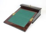 an image of a wooden desk with a green felt pad on it