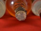 a close up of a bottle of wine with a cork sticking out of it