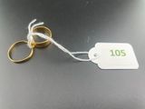 two wedding rings with a price tag attached to them