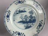 two plates with blue and white designs on them