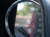 a close up of a car dashboard with a speedometer
