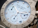 a close up of a wrist watch with a blue strap