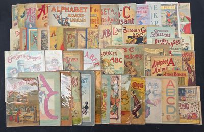 many old children ' s books on display on a table