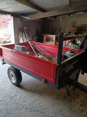 a red truck that is parked in a garage