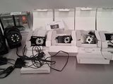 four cameras sitting in a box on a table