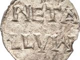 an ancient silver coin with the word ' s name written on it